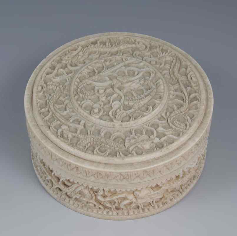 Appraisal: CHINESE CARVED IVORY COVERED BOXED Carved dragon or serpent motif