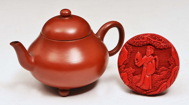 Appraisal: A CHINESE YIXING TEAPOT and cover carved with a poem