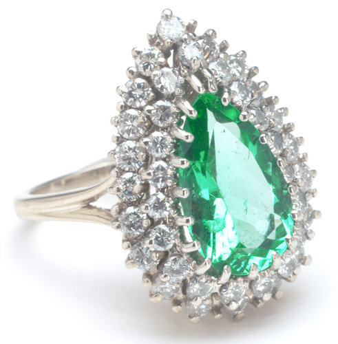 Appraisal: Emerald and diamond ring in k wg ca A pear-cut