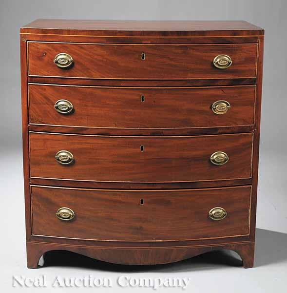 Appraisal: A Georgian Mahogany Bowfront Chest of Drawers c the top