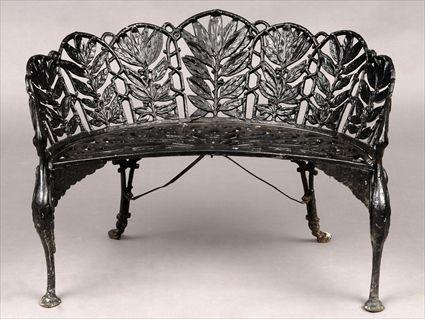 Appraisal: AMERICAN BLACK-PAINTED CAST-IRON GARDEN BENCH The curved back with pierced