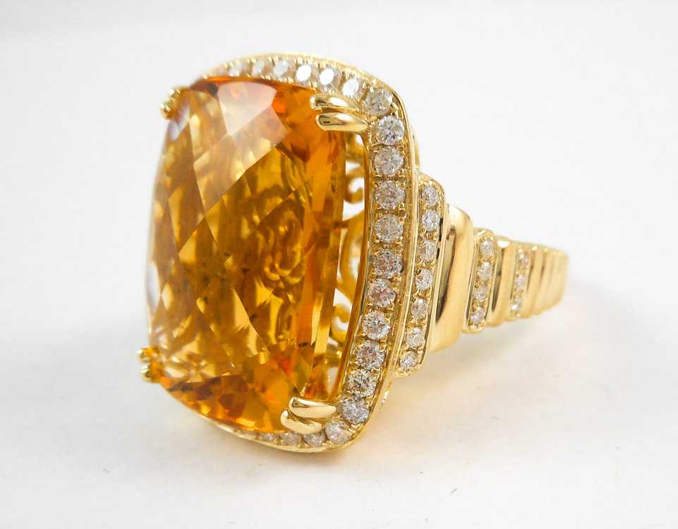 Appraisal: CITRINE DIAMOND AND FOURTEEN KARAT GOLD RING with round-cut diamonds