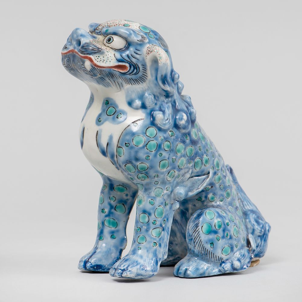 Appraisal: Japanese Porcelain Model of a Buddhistic Lion Unmarked with two