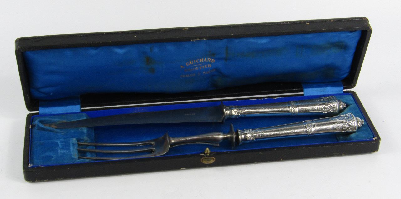 Appraisal: A French white metal and steel carving set with engraved