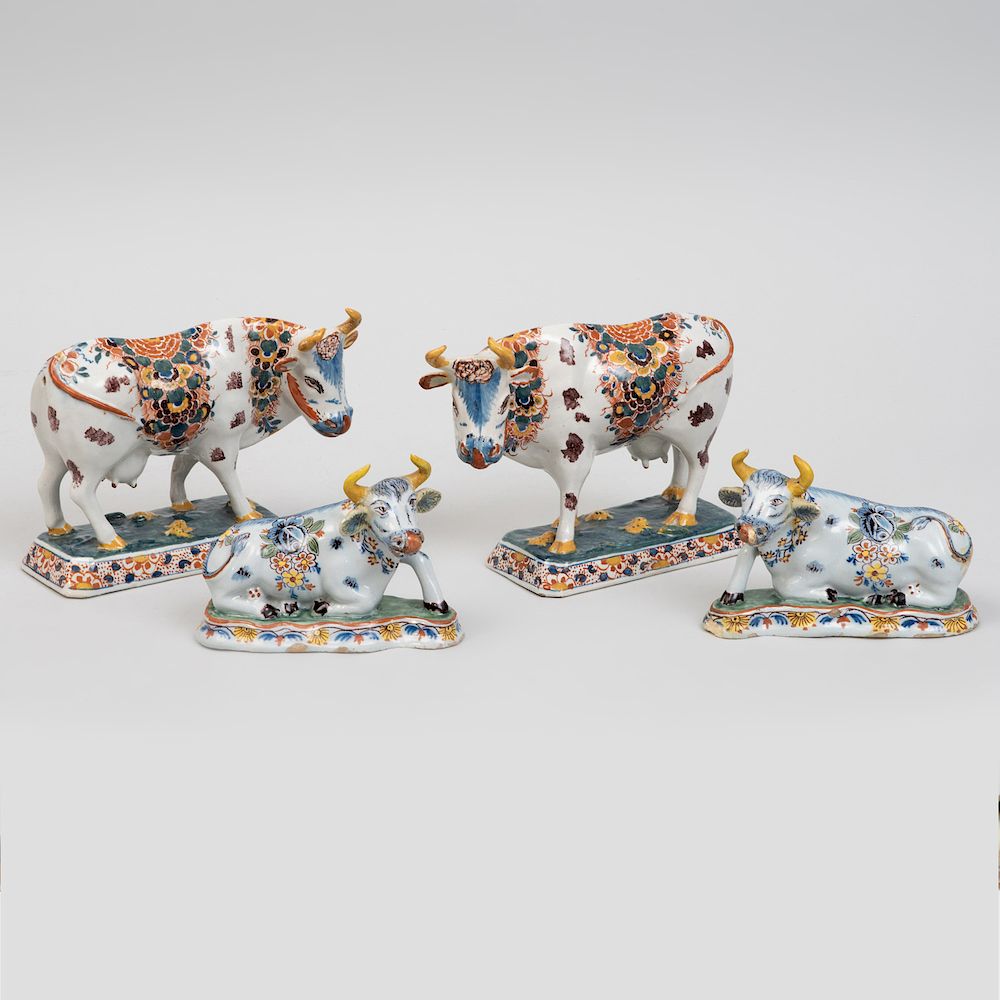 Appraisal: Two Pairs of Dutch Polychrome Delft Models of Cows The