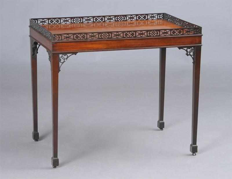 Appraisal: GEORGE III MAHOGANY SILVER TABLE The rectangular galleried top raised