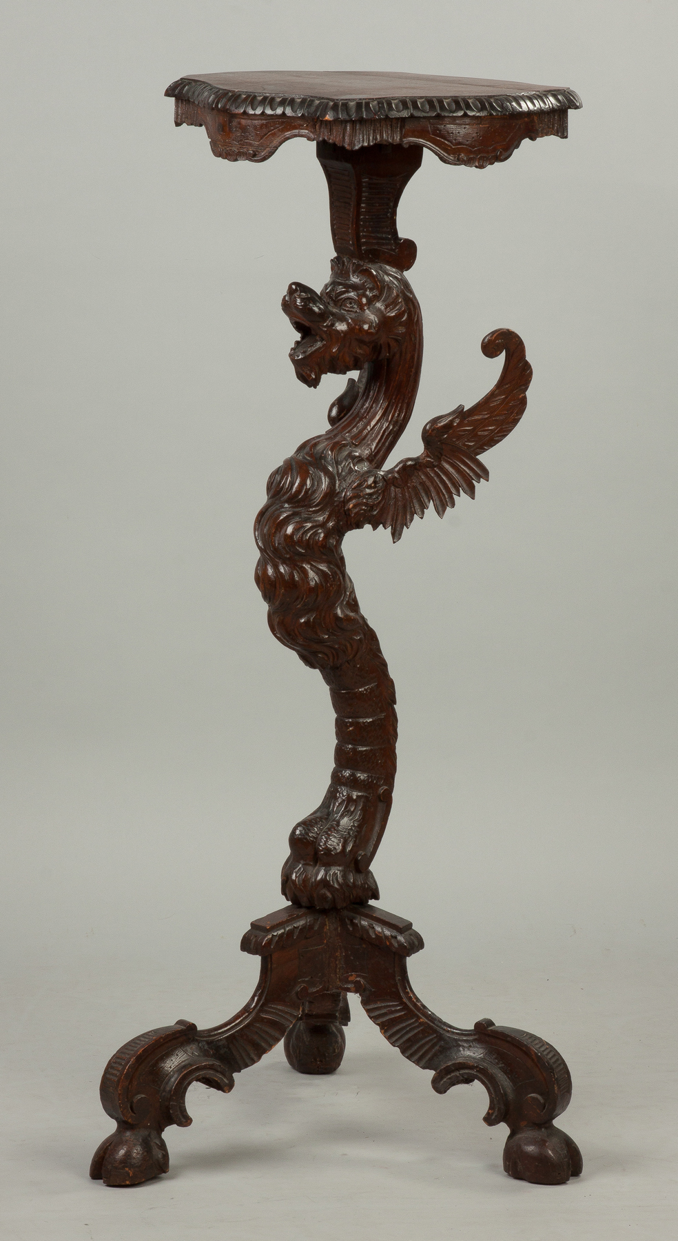 Appraisal: Continental Carved Walnut Winged Griffin Pedestal With hoof feet