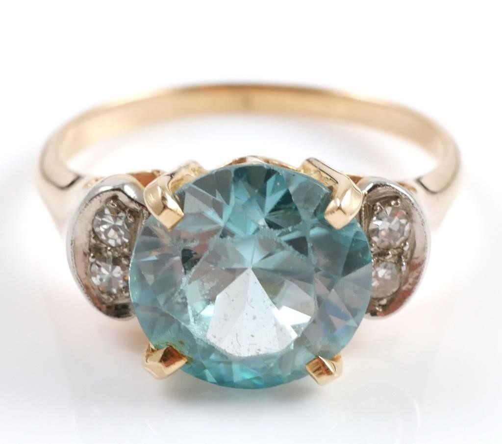 Appraisal: K yellow gold ring contains one round mixed cut blue