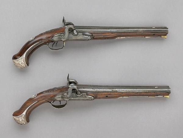 Appraisal: A pair of silver-mounted continental double barreled percussion conversion pistolslate