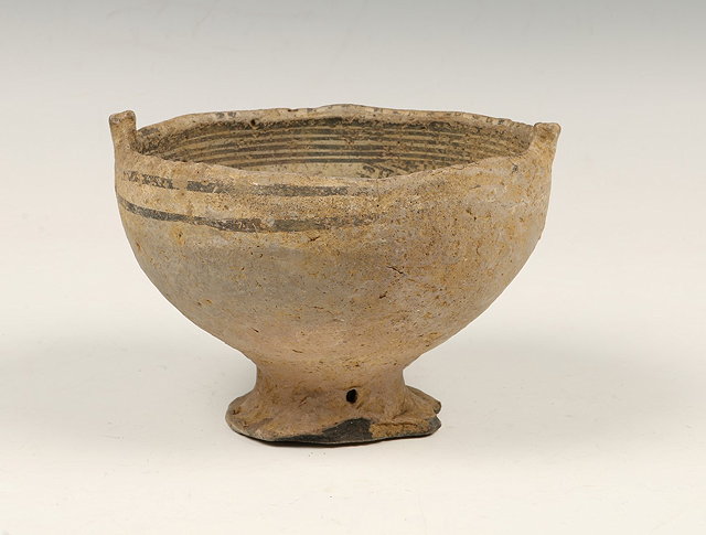 Appraisal: A MEXICAN BOWL with spreading foot and rattle painted lines