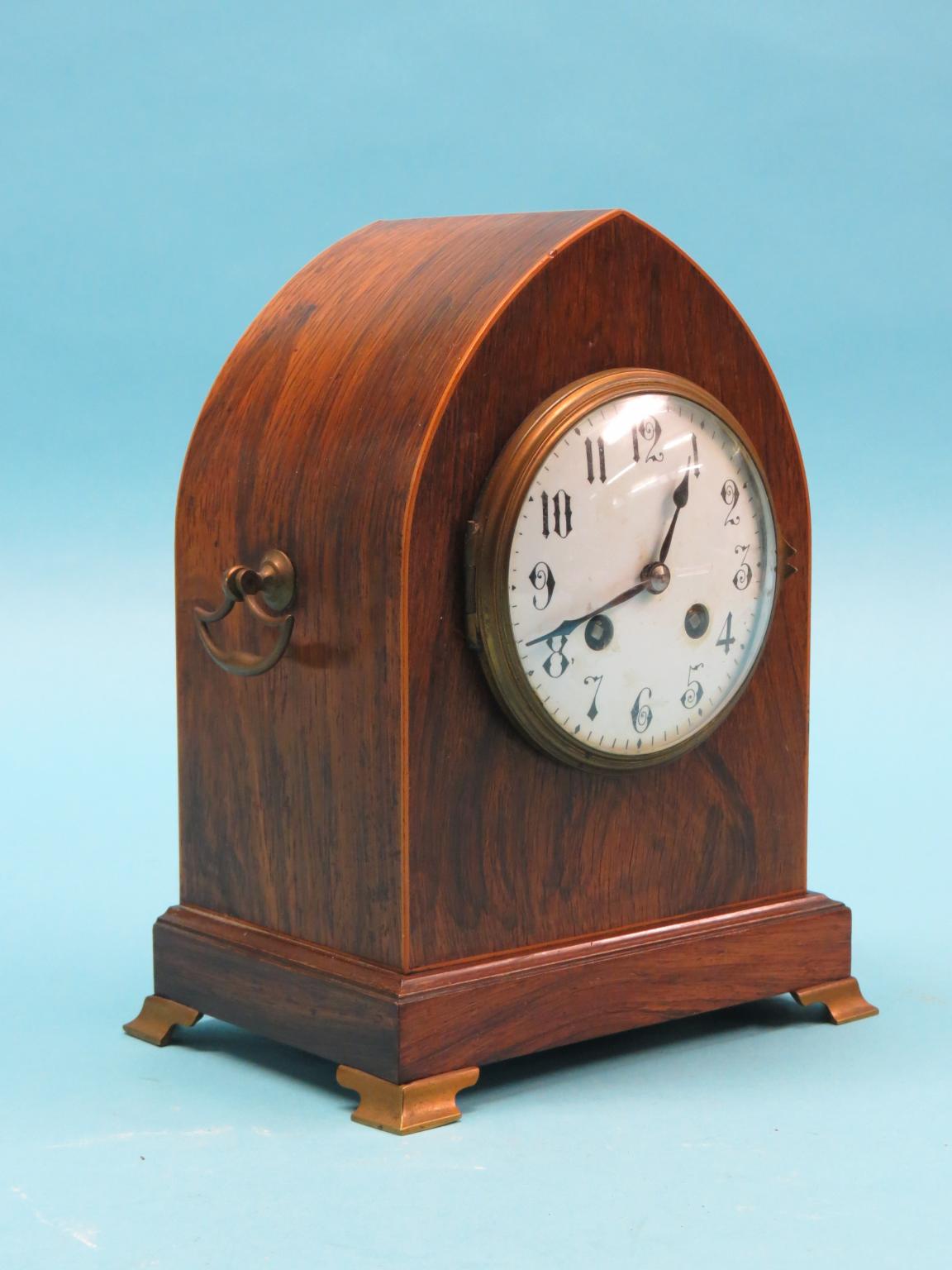 Appraisal: A Victorian rosewood mantel clock in convex enamelled dial and