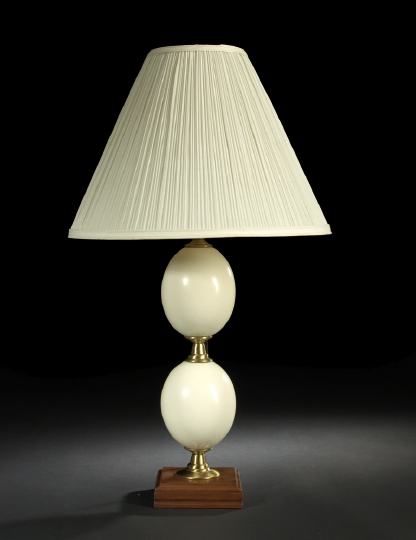 Appraisal: Pair of Stacked Matte-Finished Brass-Mounted Ostrich Eggs forming a table