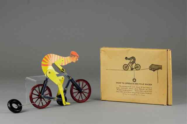 Appraisal: BOXED TURTLE NECK BICYCLIST STRING TOY Quadriga Mfg Chicago die