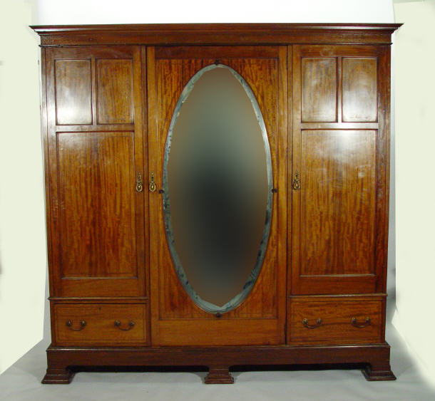 Appraisal: Edwardian inlaid mahogany triple wardrobe the central door with bevel