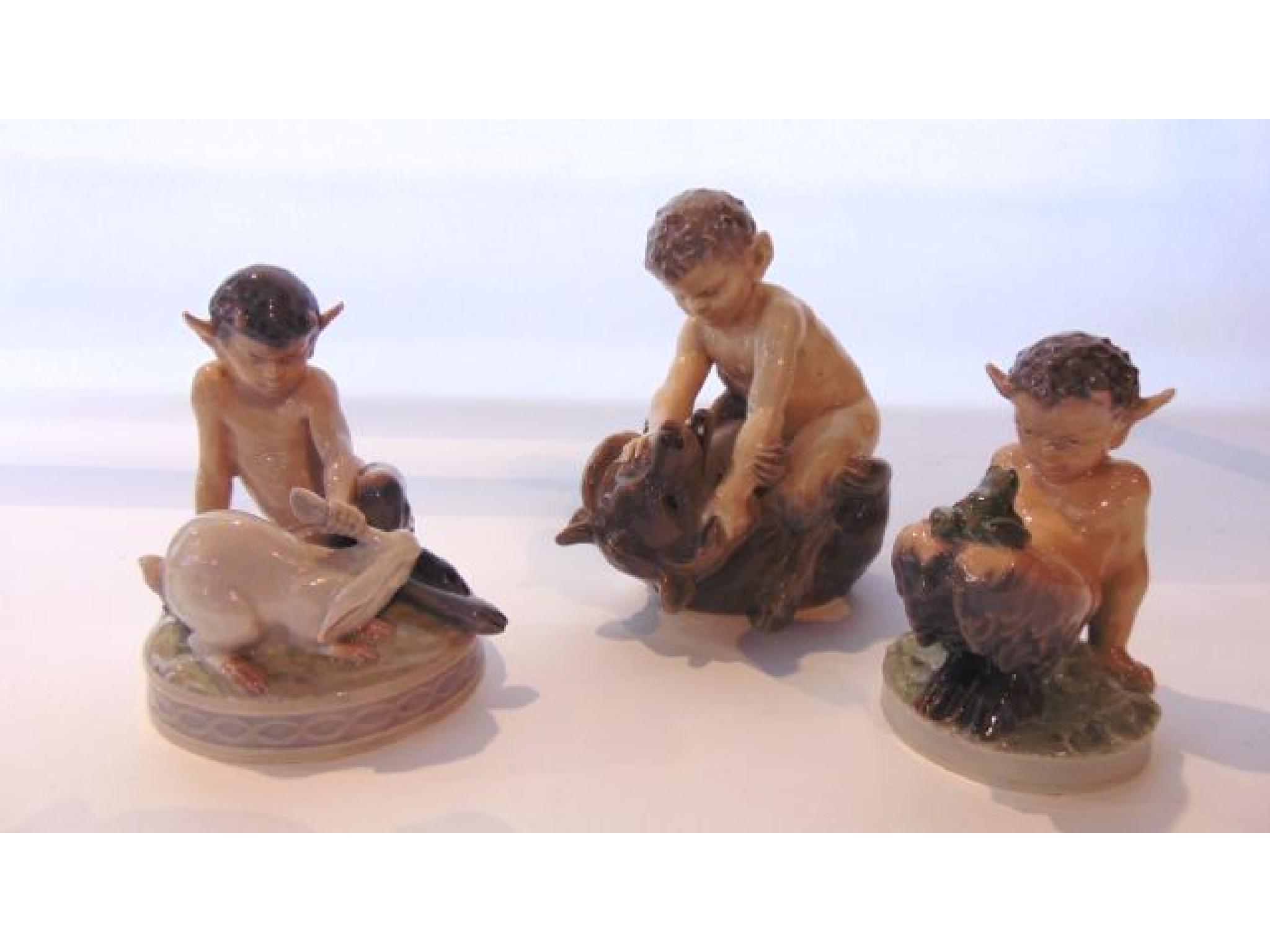 Appraisal: A collection of three Royal Copenhagen models of fauns one