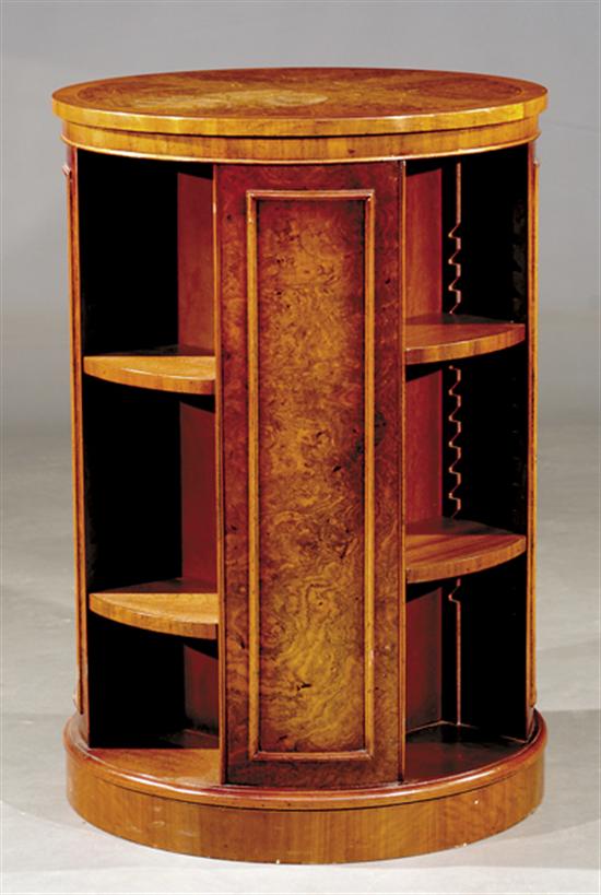 Appraisal: Regency style mahogany and burl walnut revolving bookcase circular form