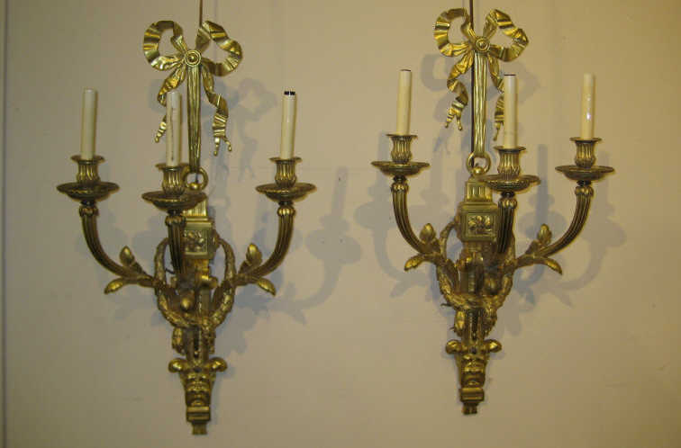 Appraisal: PAIR CONTINENTAL GILT BRONZE WALL SCONCES Each with a ribbon