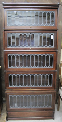 Appraisal: STACKING MAHOGANY AND LEADED GLASS SECTIONAL BOOKCASE attributed to The