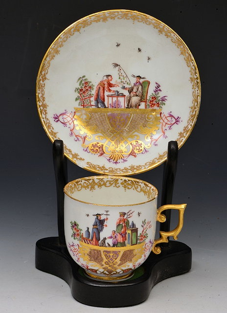 Appraisal: A MEISSEN CUP AND SAUCER painted in the manner of