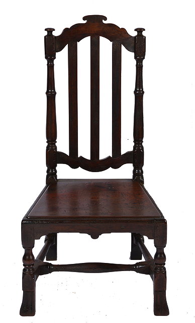 Appraisal: A WILLIAM MARY WALNUT SIDE CHAIR with shaped cresting rail