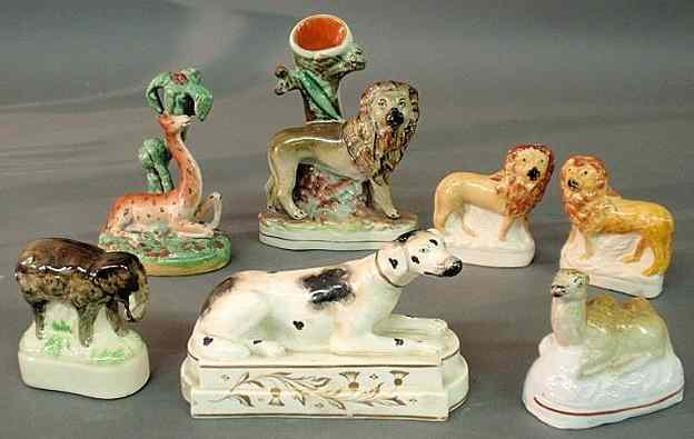 Appraisal: Seven th c Staffordshire animals including a pair of lions