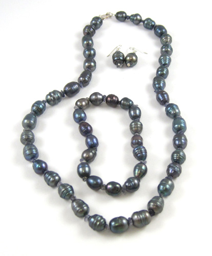 Appraisal: FOUR ARTICLES OF BAROQUE PEARL JEWELRY consisting of a black