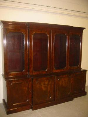 Appraisal: A VICTORIAN MAHOGANY TWO STAGE BOOKCASE of breakfront form moulded