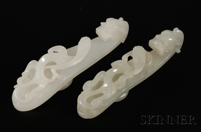 Appraisal: Two Jade Garment Hooks th century a green-white stone and