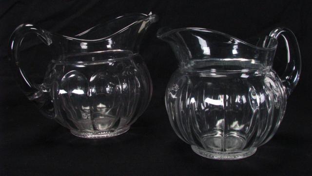 Appraisal: Two Heisey Glass Pitchers Puritan pattern '' high and ''