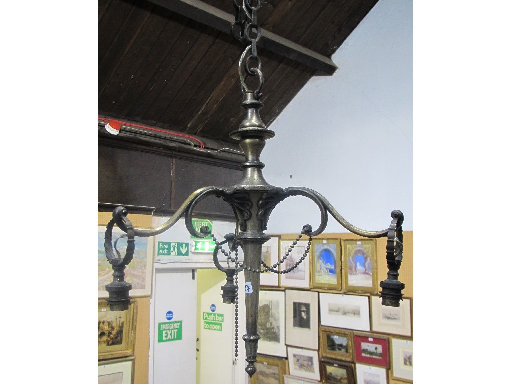 Appraisal: Two oxidised three branch candelabra ceiling lights