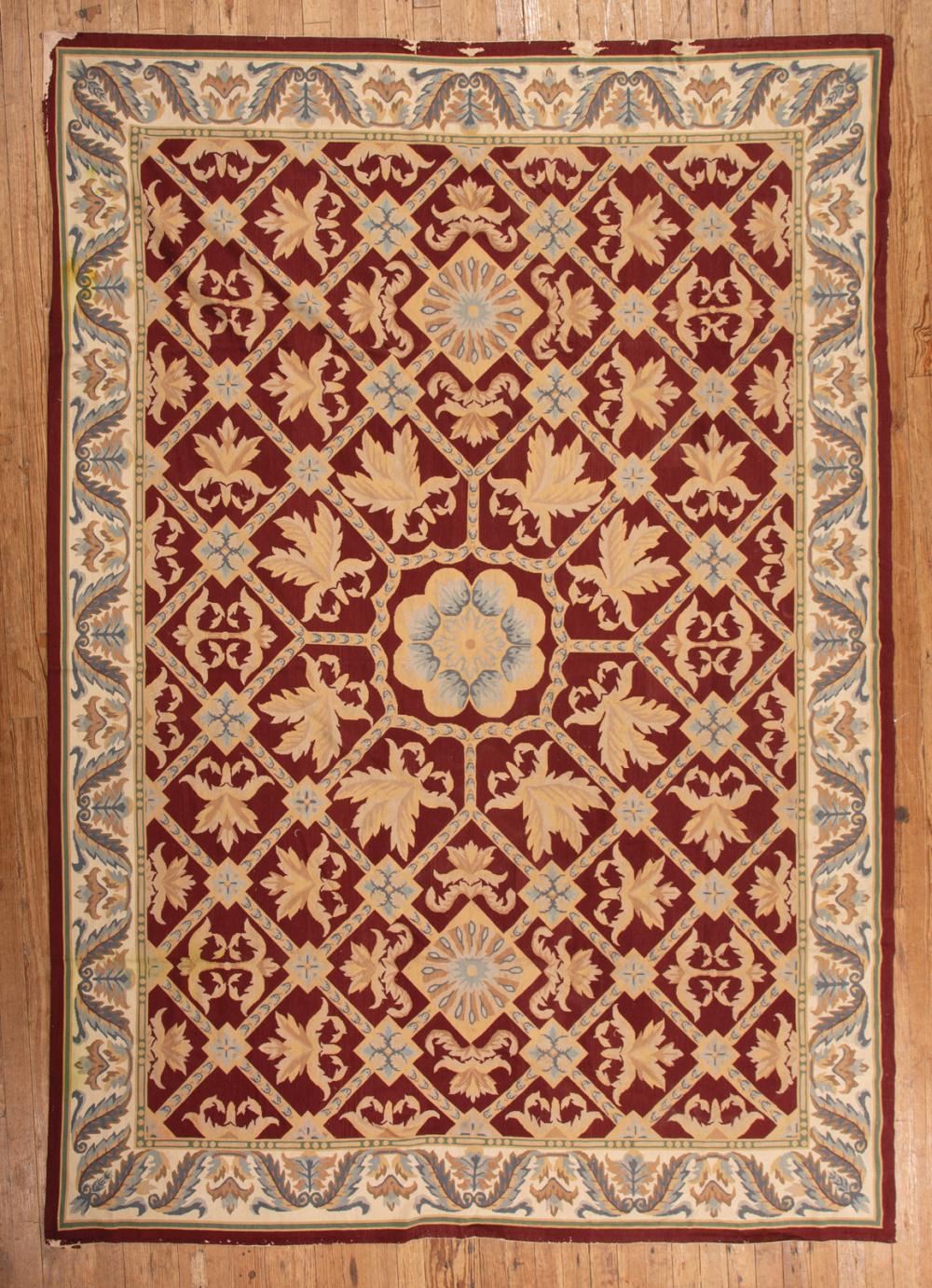 Appraisal: Aubusson-Style Carpet red ground floral and geometric design ft in