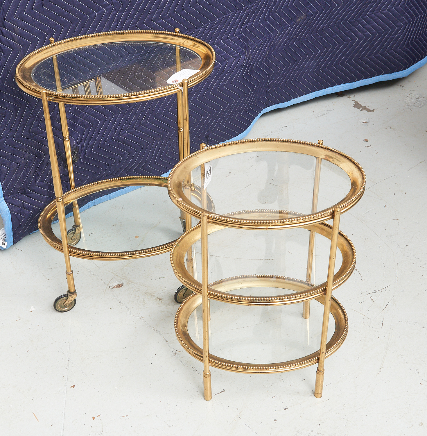 Appraisal: MID-CENTURY BRASS GLASS TIERED TABLES th c incl a two