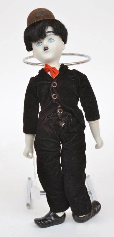 Appraisal: UNMARKED BISQUE CHARLIE CHAPLIN DOLL UNMARKED BISQUE CHARLIE CHAPLIN DOLL