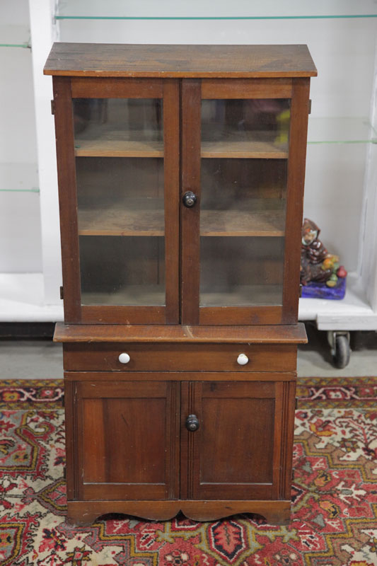 Appraisal: CHILD'S SIZE STEPBACK CUPBOARD Pine having two glazed and paneled