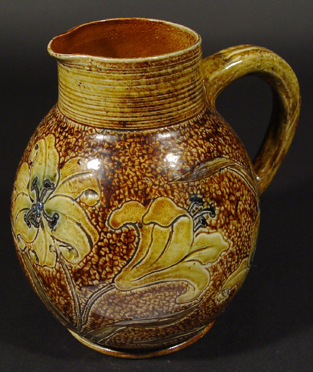 Appraisal: Martin Brothers saltglazed stoneware jug incised with flowers under a