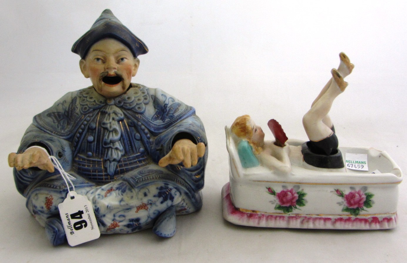 Appraisal: A German porcelain 'nodding' figure modelled as a seated Oriental