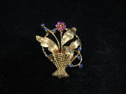 Appraisal: karat yellow gold and gem set flower brooch Delicate basket