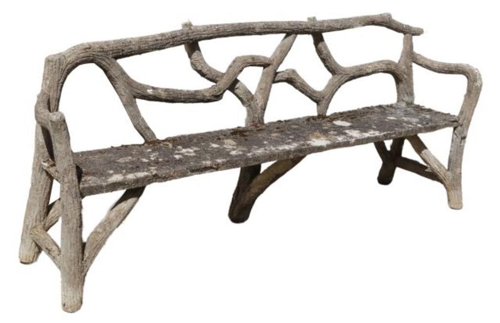 Appraisal: Cast stone faux bois garden bench openwork branch back over