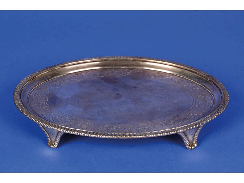 Appraisal: A GEORGE III OVAL WAITER with a raised gadrooned border