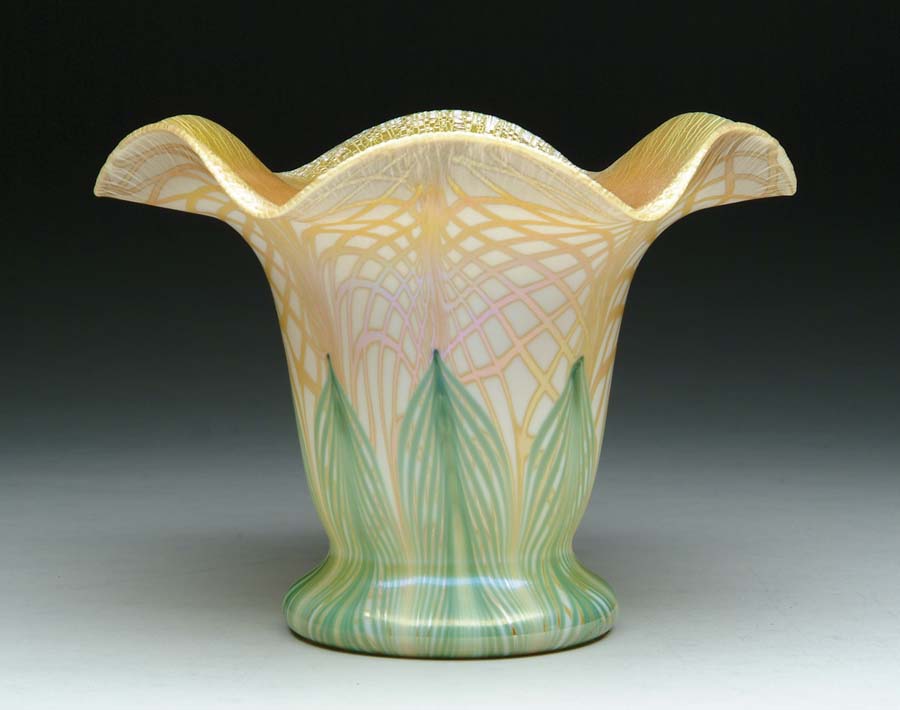 Appraisal: DECORATED QUEZAL VASE Beautiful Quezal vase has cream colored glass