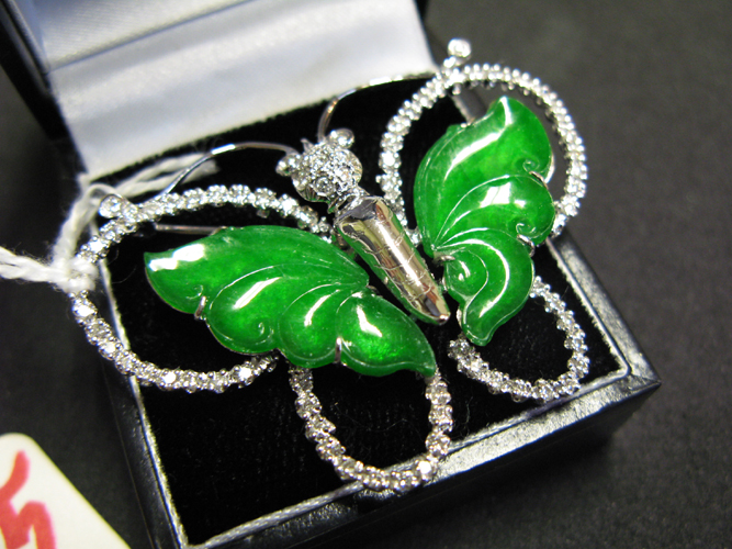 Appraisal: JADE DIAMOND AND FOURTEEN KARAT WHITE GOLD BUTTERFLY BROOCH The