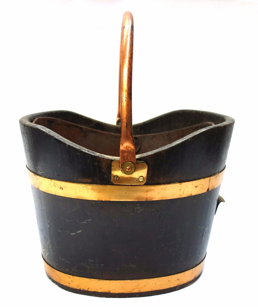 Appraisal: An th century design brass bound coopered oak peat bucket