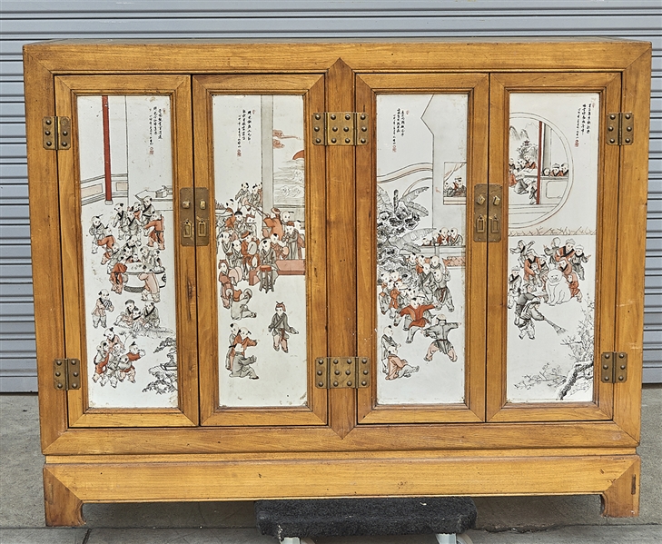 Appraisal: Chinese wood cabinet with porcelain plaque paneled doors each with