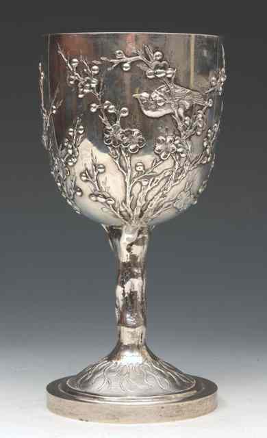 Appraisal: A CHINESE SILVER GOBLET with oriental birds and blossom on