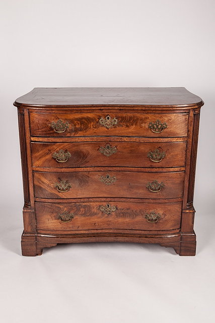 Appraisal: A GEORGE III MAHOGANY SHAPED FRONT CHEST of drawers with