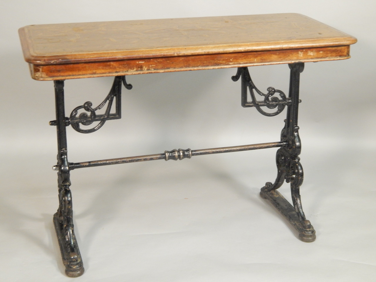 Appraisal: A Victorian pub table with a mahogany top on cast