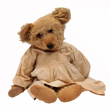 Appraisal: AN OLD POSSIBLY GERMAN PLUSH COVERED TEDDY BEAR now wearing