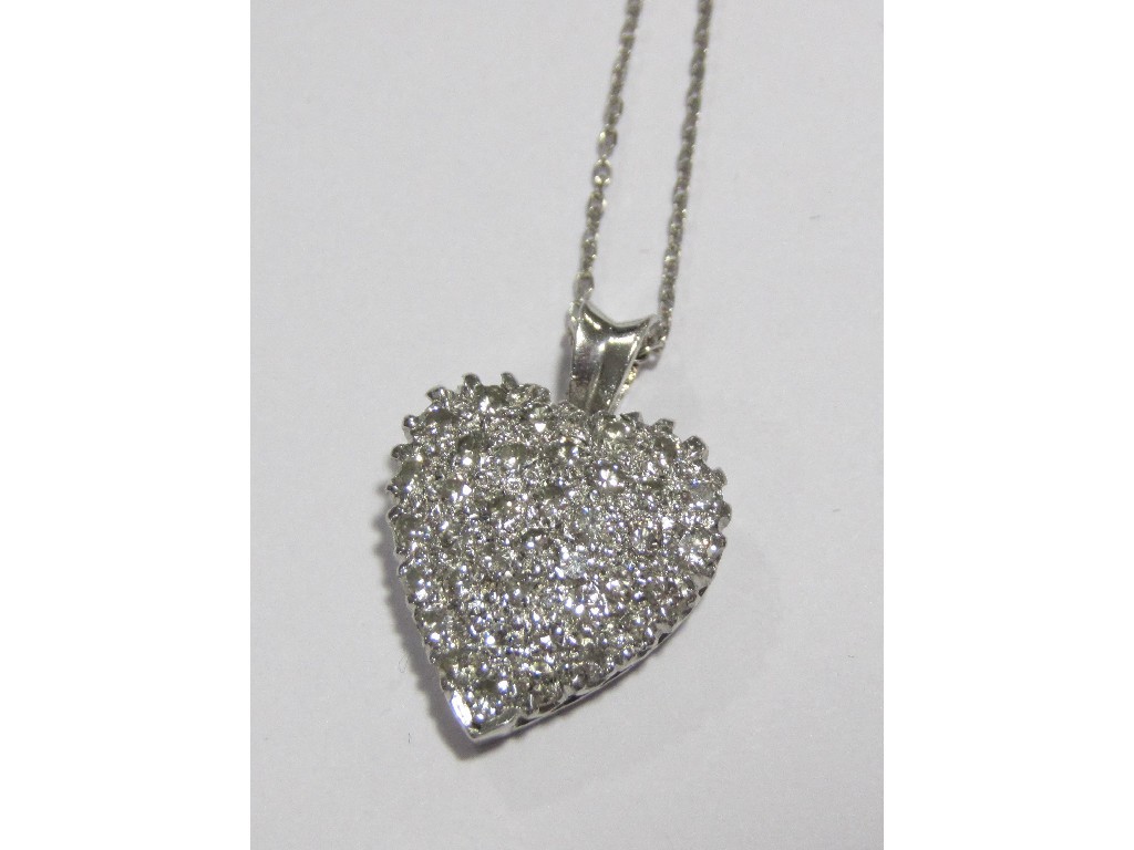 Appraisal: A fourteen carat white gold diamond heart shaped pendant pave