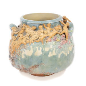 Appraisal: An Earthenware Vase Depicting The Struggle for Life Attributed to