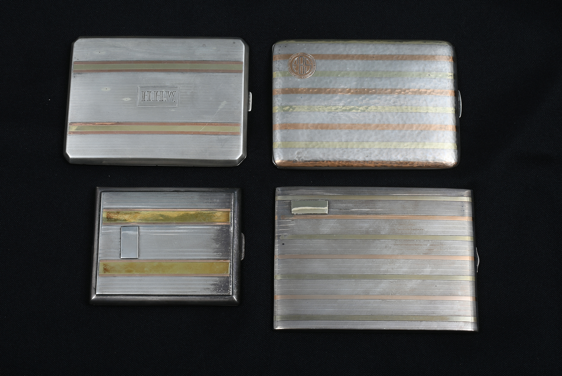 Appraisal: PC K GOLD INLAID SILVER CIGARETTE CASES Comprising - Schira